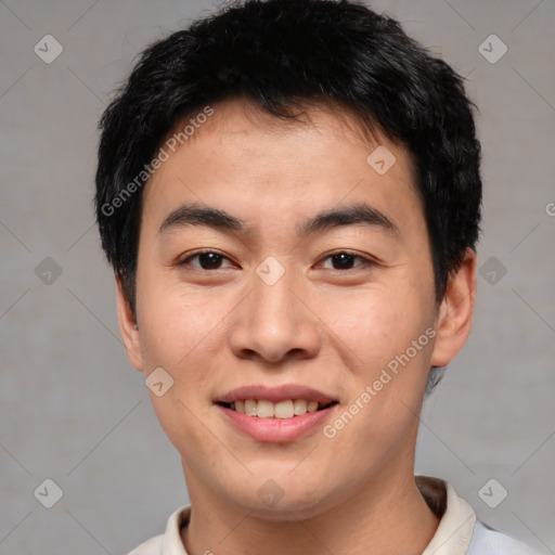 Joyful asian young-adult male with short  black hair and brown eyes