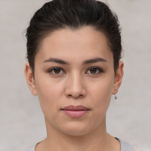 Joyful white young-adult female with short  brown hair and brown eyes
