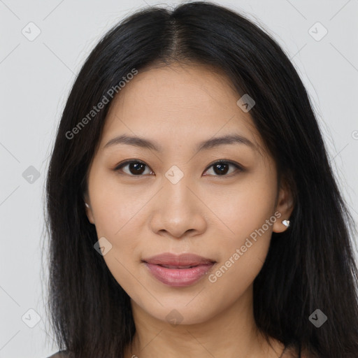 Joyful latino young-adult female with long  brown hair and brown eyes