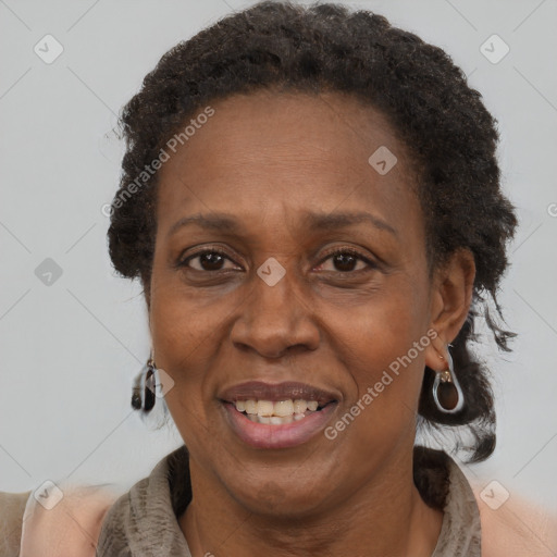 Joyful black adult female with short  brown hair and brown eyes