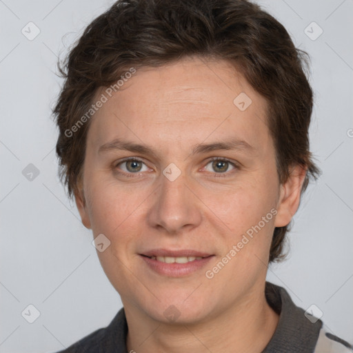 Joyful white adult female with short  brown hair and grey eyes