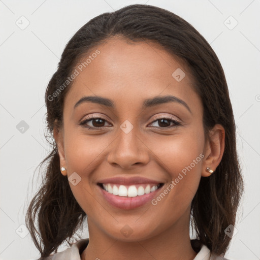 Joyful white young-adult female with long  brown hair and brown eyes