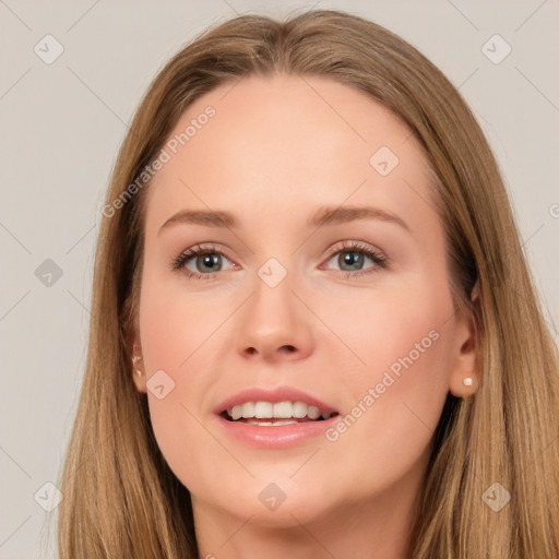 Joyful white young-adult female with long  brown hair and blue eyes