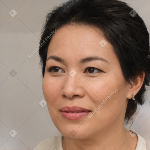 Joyful white adult female with medium  brown hair and brown eyes