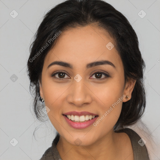 Joyful latino young-adult female with long  black hair and brown eyes