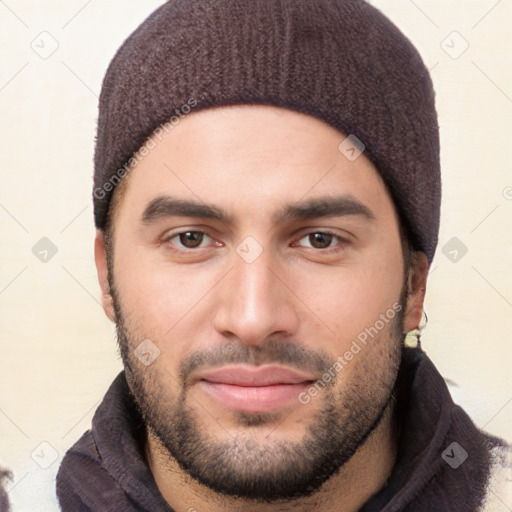 Joyful white young-adult male with short  black hair and brown eyes