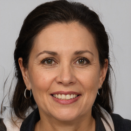 Joyful white adult female with medium  brown hair and brown eyes