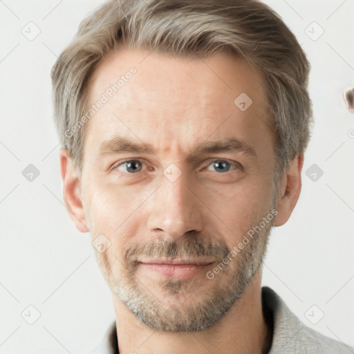 Joyful white adult male with short  brown hair and grey eyes