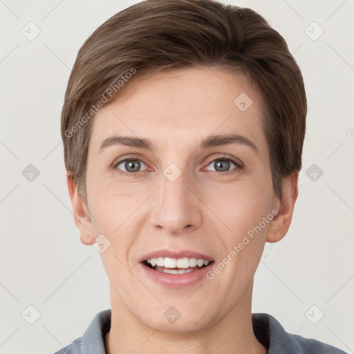 Joyful white young-adult female with short  brown hair and grey eyes