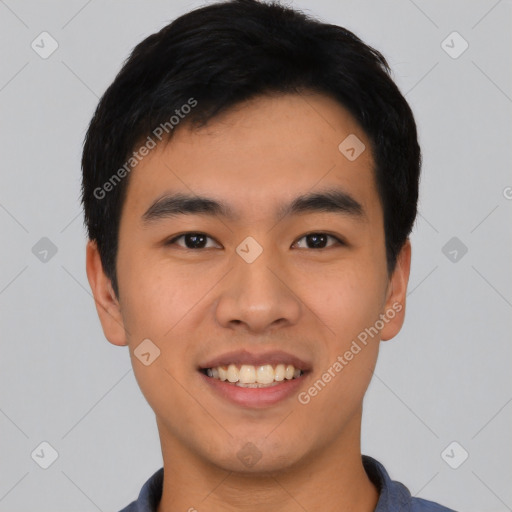 Joyful asian young-adult male with short  black hair and brown eyes