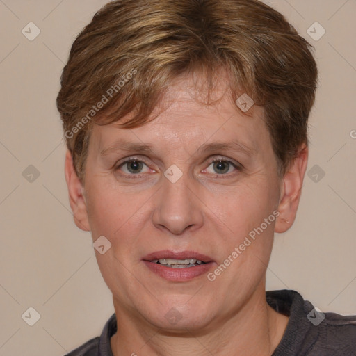 Joyful white adult female with short  brown hair and brown eyes