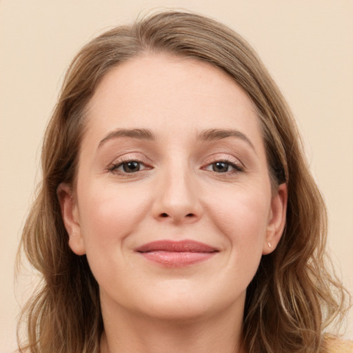 Joyful white young-adult female with long  brown hair and grey eyes