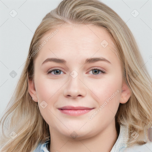 Joyful white young-adult female with long  brown hair and blue eyes