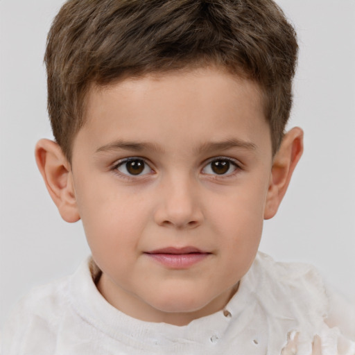 Joyful white child male with short  brown hair and brown eyes