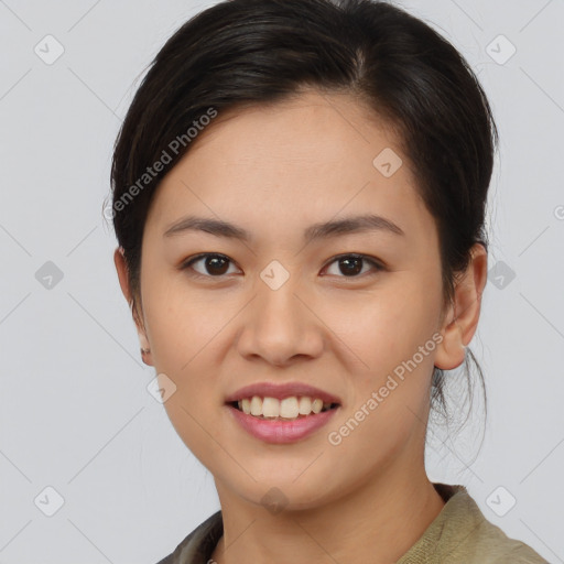 Joyful asian young-adult female with medium  brown hair and brown eyes