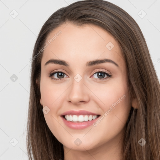 Joyful white young-adult female with long  brown hair and brown eyes