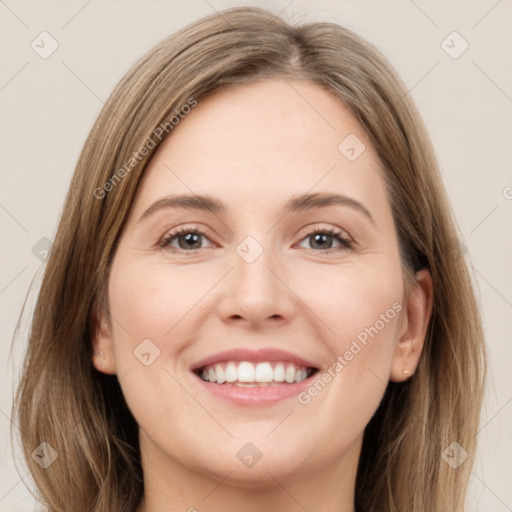 Joyful white young-adult female with long  brown hair and grey eyes