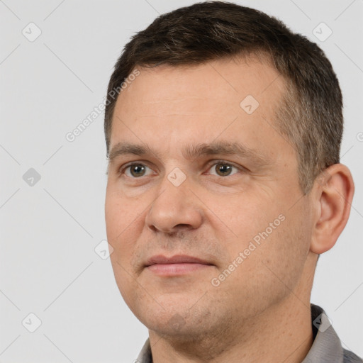 Joyful white adult male with short  brown hair and brown eyes