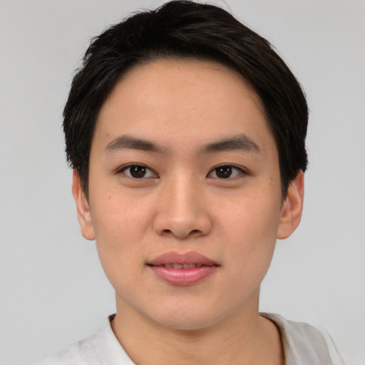 Joyful asian young-adult male with short  black hair and brown eyes