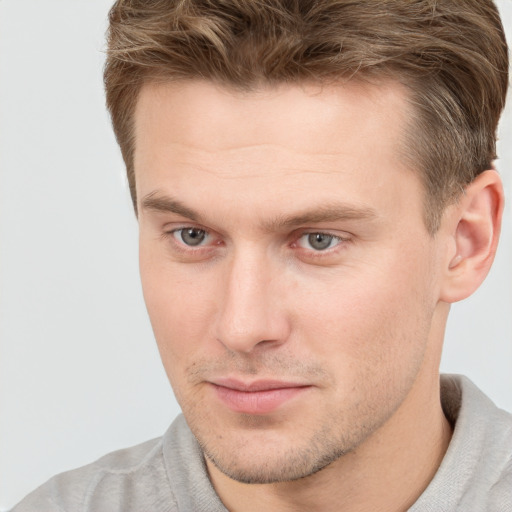 Neutral white young-adult male with short  brown hair and grey eyes