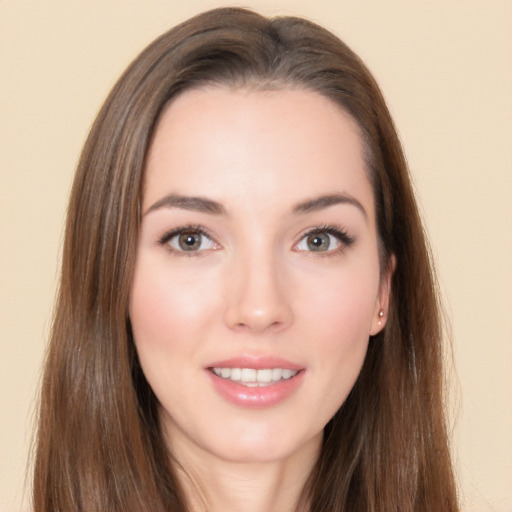 Joyful white young-adult female with long  brown hair and brown eyes