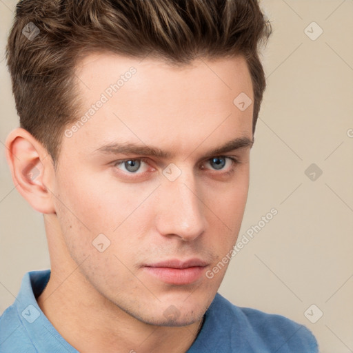 Neutral white young-adult male with short  brown hair and grey eyes