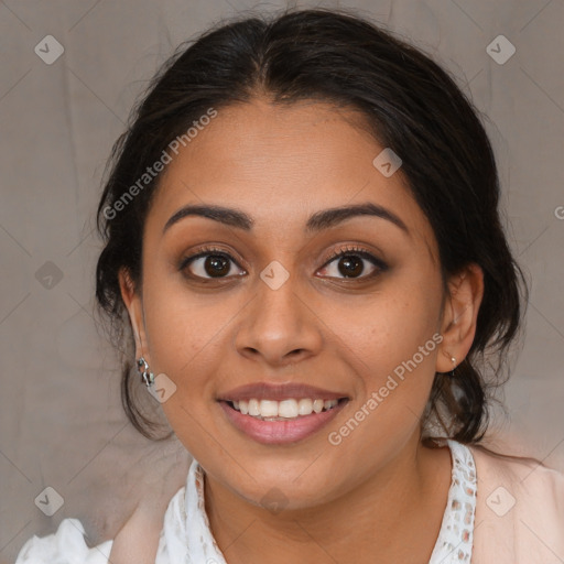 Joyful latino young-adult female with medium  brown hair and brown eyes