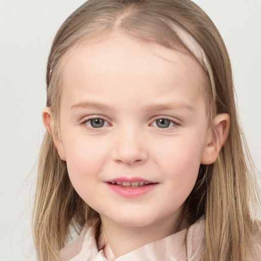 Joyful white child female with medium  brown hair and blue eyes