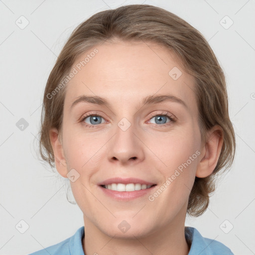 Joyful white young-adult female with medium  brown hair and blue eyes