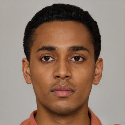 Neutral latino young-adult male with short  brown hair and brown eyes