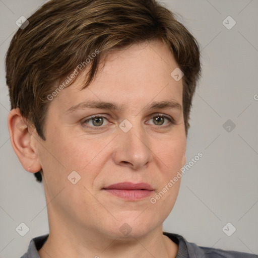 Joyful white adult female with short  brown hair and grey eyes