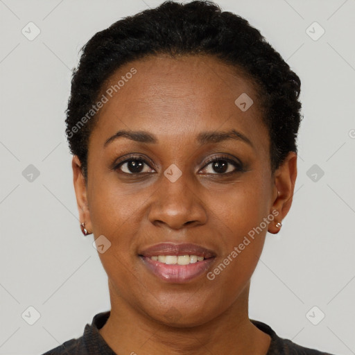 Joyful black young-adult female with short  black hair and brown eyes