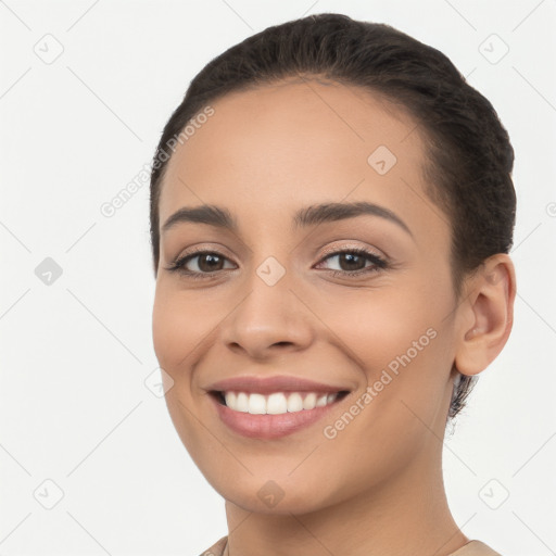 Joyful white young-adult female with long  brown hair and brown eyes