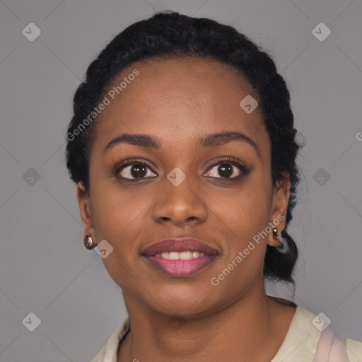 Joyful black young-adult female with short  black hair and brown eyes