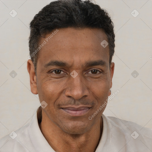 Joyful black adult male with short  brown hair and brown eyes