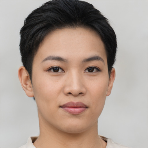 Joyful asian young-adult female with short  black hair and brown eyes