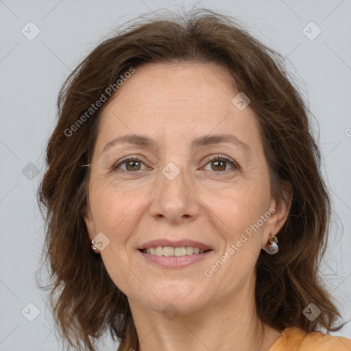 Joyful white adult female with medium  brown hair and brown eyes