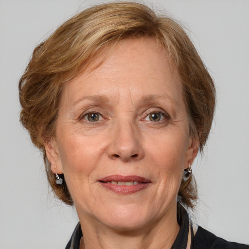 Joyful white middle-aged female with medium  brown hair and brown eyes