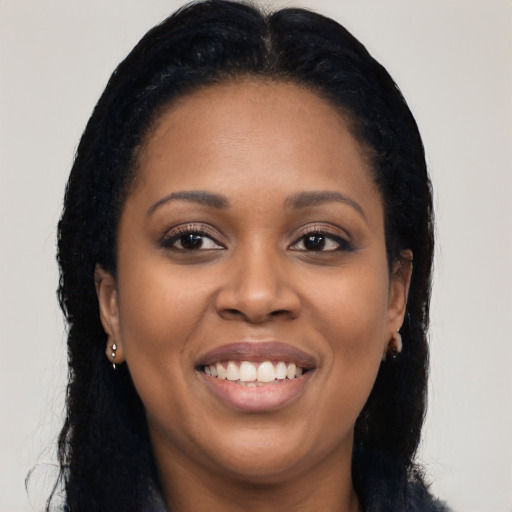 Joyful latino young-adult female with long  black hair and brown eyes