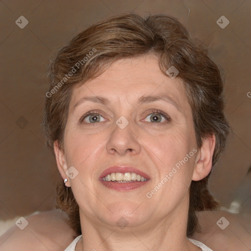 Joyful white adult female with medium  brown hair and grey eyes