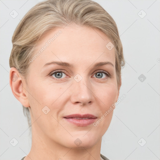 Joyful white adult female with short  brown hair and grey eyes