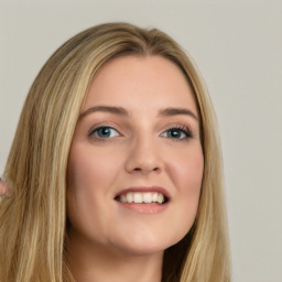 Joyful white young-adult female with long  brown hair and green eyes