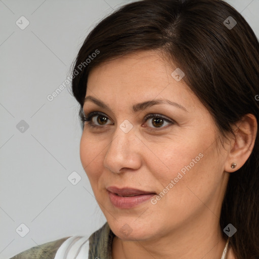 Joyful white adult female with medium  brown hair and brown eyes