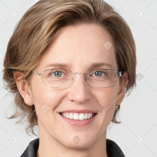 Joyful white adult female with medium  brown hair and blue eyes