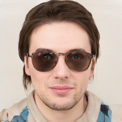 Joyful white young-adult male with medium  brown hair and blue eyes