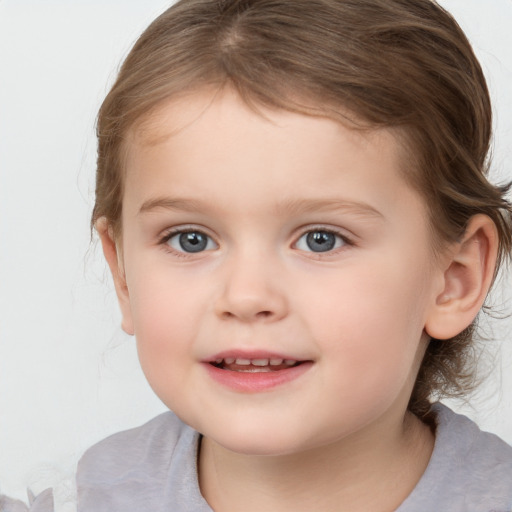 Joyful white child female with medium  brown hair and brown eyes