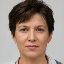 Joyful white adult female with short  brown hair and brown eyes