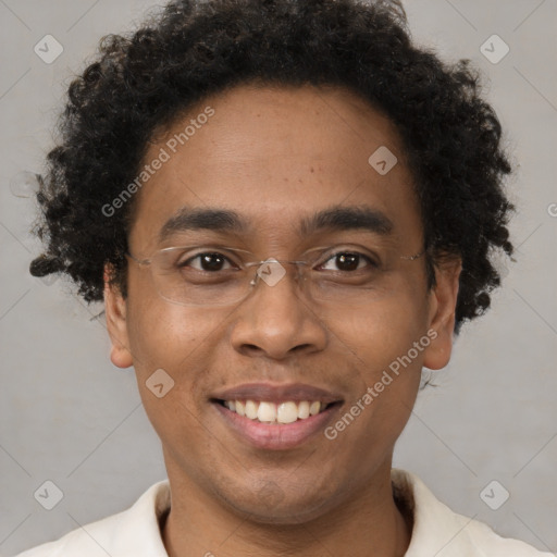 Joyful black young-adult male with short  brown hair and brown eyes