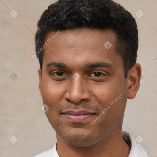 Joyful latino young-adult male with short  black hair and brown eyes