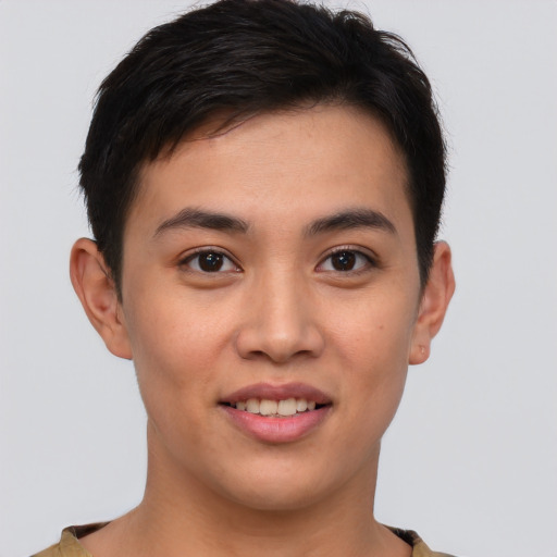 Joyful asian young-adult male with short  brown hair and brown eyes